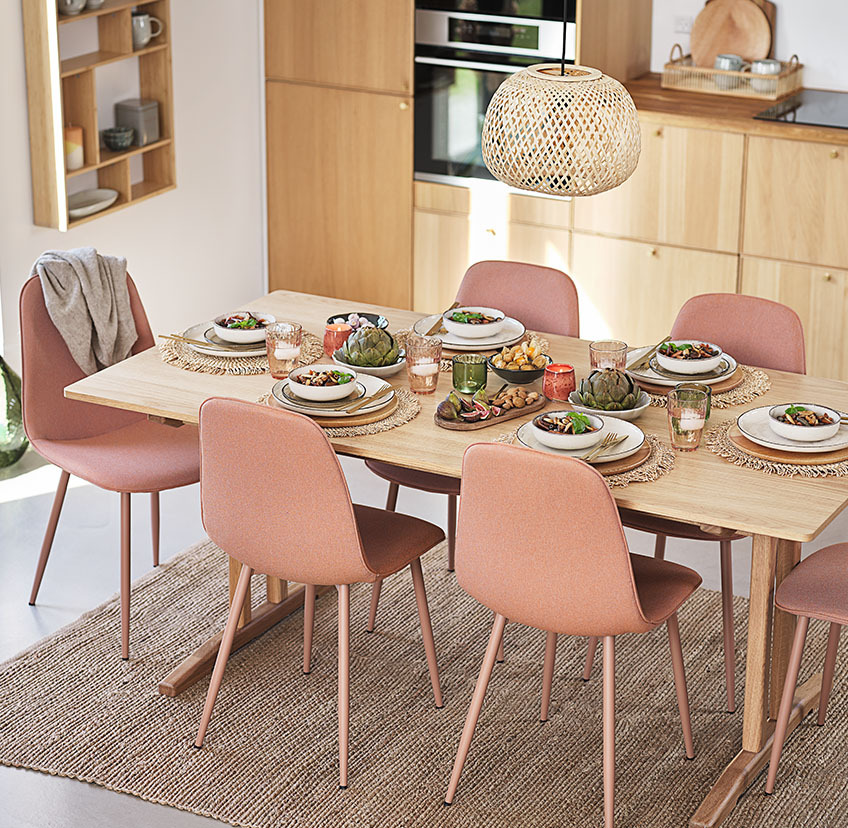 Soft peach dining chairs around dining table in kitchen