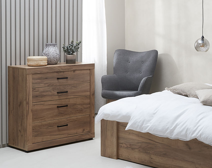 Wooden chest of drawers in bedroom