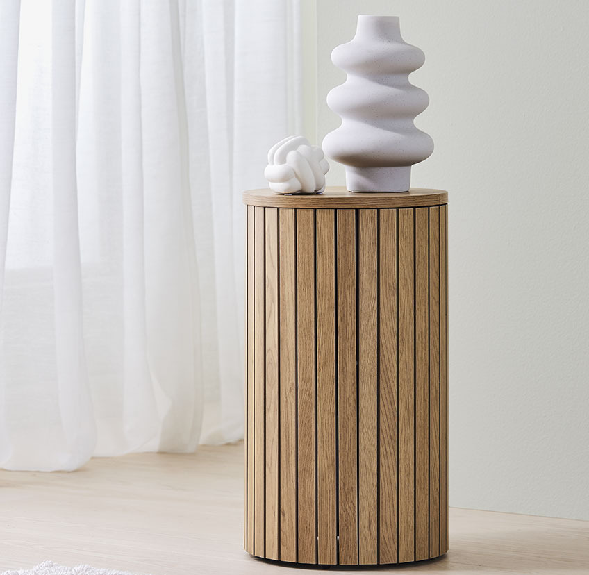 Wooden pedestal made from oak with white vase