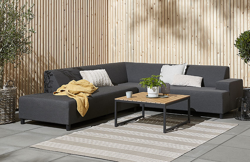 Large garden lounge sofa with wood lounge table