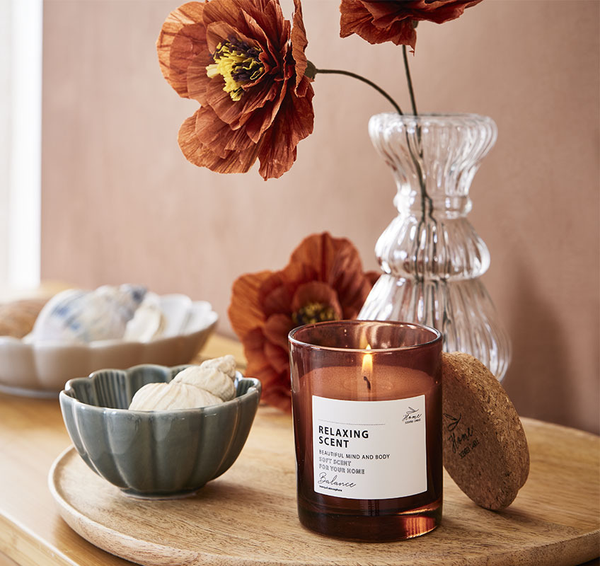 PER paper flower, JENS scented candle, and SIMON bowl Scented candle and small bowl on wooden tray
