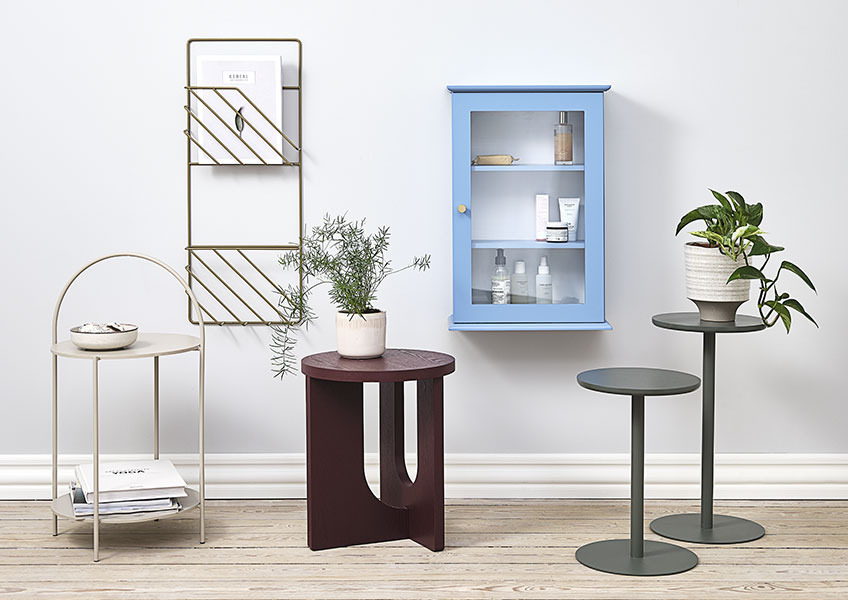 ARCH end table, STAND IN flower stand, MALLING wall cabinet, HALBY end table, and MAGSTRUP magazine holder. End tables, flower stand, wall cabinet and gold magazine holder displayed together.