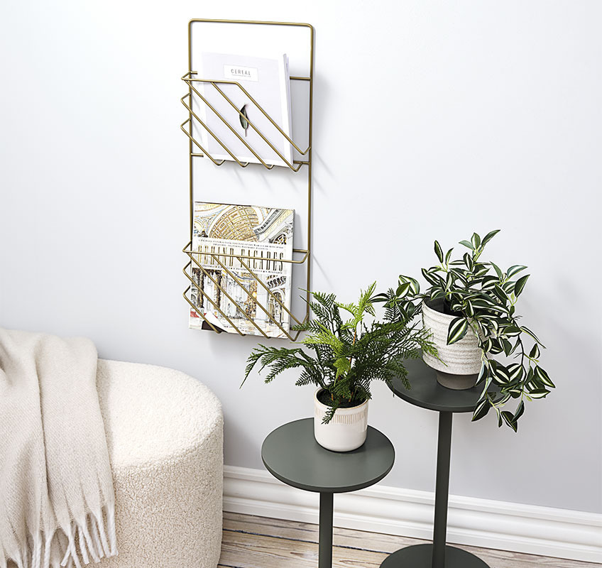 STAND IN flower stands and MAGSTRUP magazine holder in gold Two flower stands in green and a gold magazine holder hanging on the wall