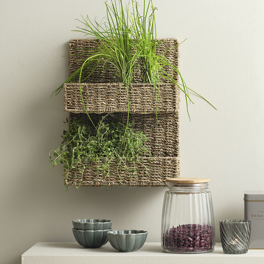 LAU seagrass basket, SIMON bowls and KJETIL storage jar Seagrass basket hanging on a wall in a kitchen