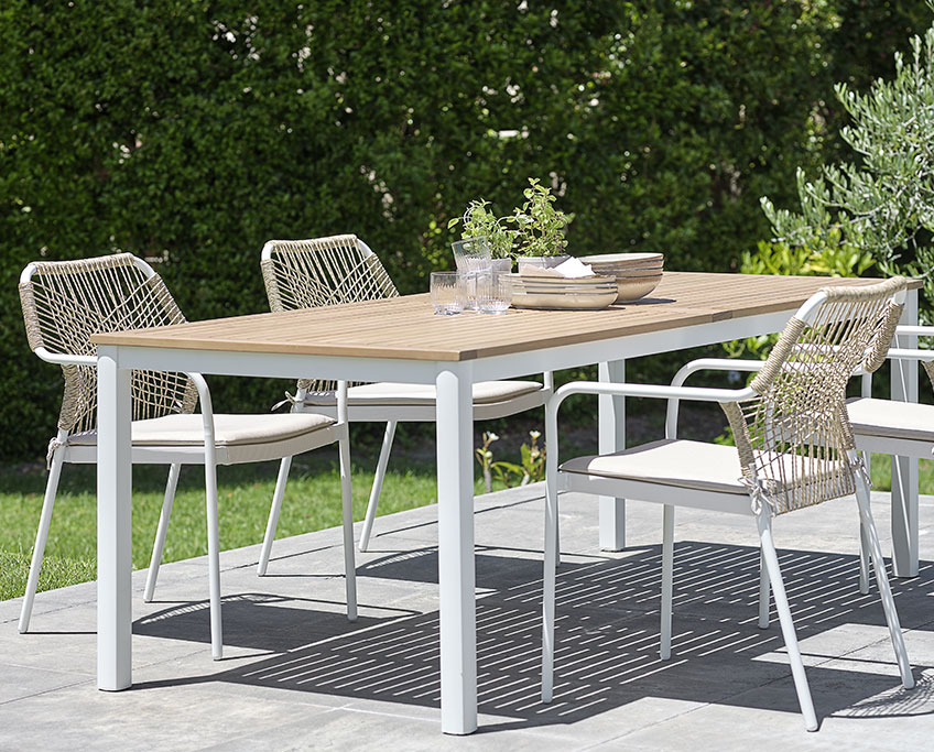 RAMTEN garden table and FASTRUP stacking chairs Garden table with white frame and wooden top and four stacking chairs
